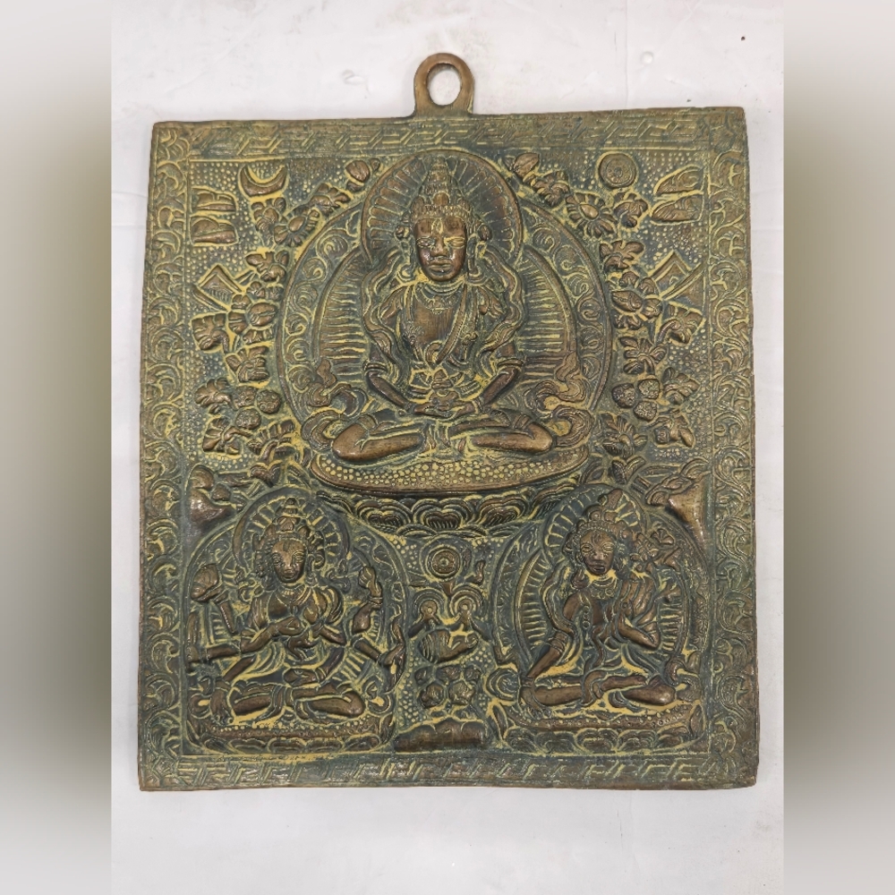Btass Wall Plaque depicting the‎ Buddhist deity Vasudhara, the goddess of wealth